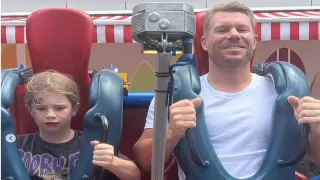 David Warner enjoyed the adventure ride by sitting on a dangerous swing with his daughter