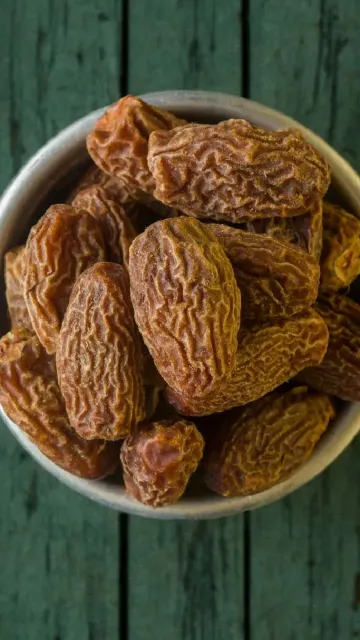 Eating chuara (Dates) in winter Picture