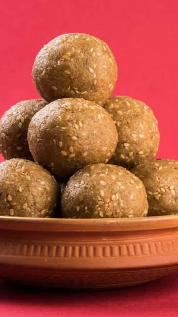Eating ginger ladoos in winter Picture